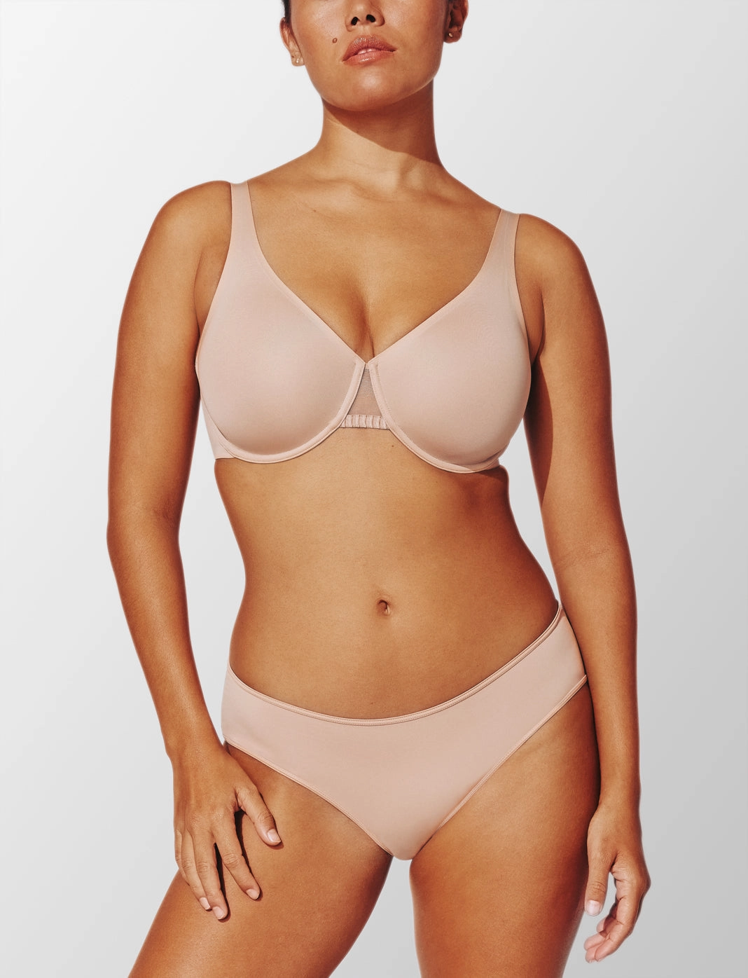 Model in the 24/7® Classic Unlined Minimizer Bra in taupe