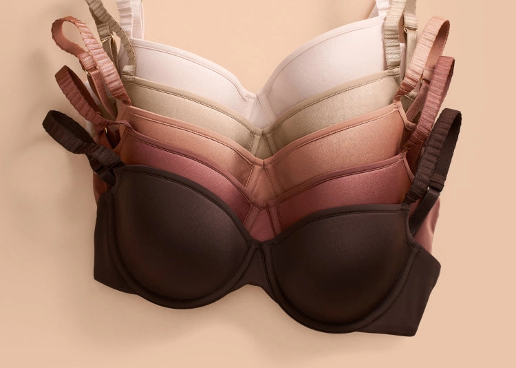 A stack of ThirdLove bras in a range of shades